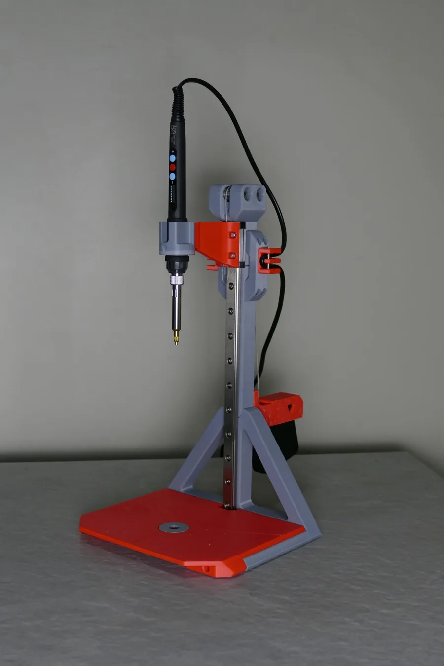 Orange and grey 3D printed heat-set insert press fixture built by Nox Print